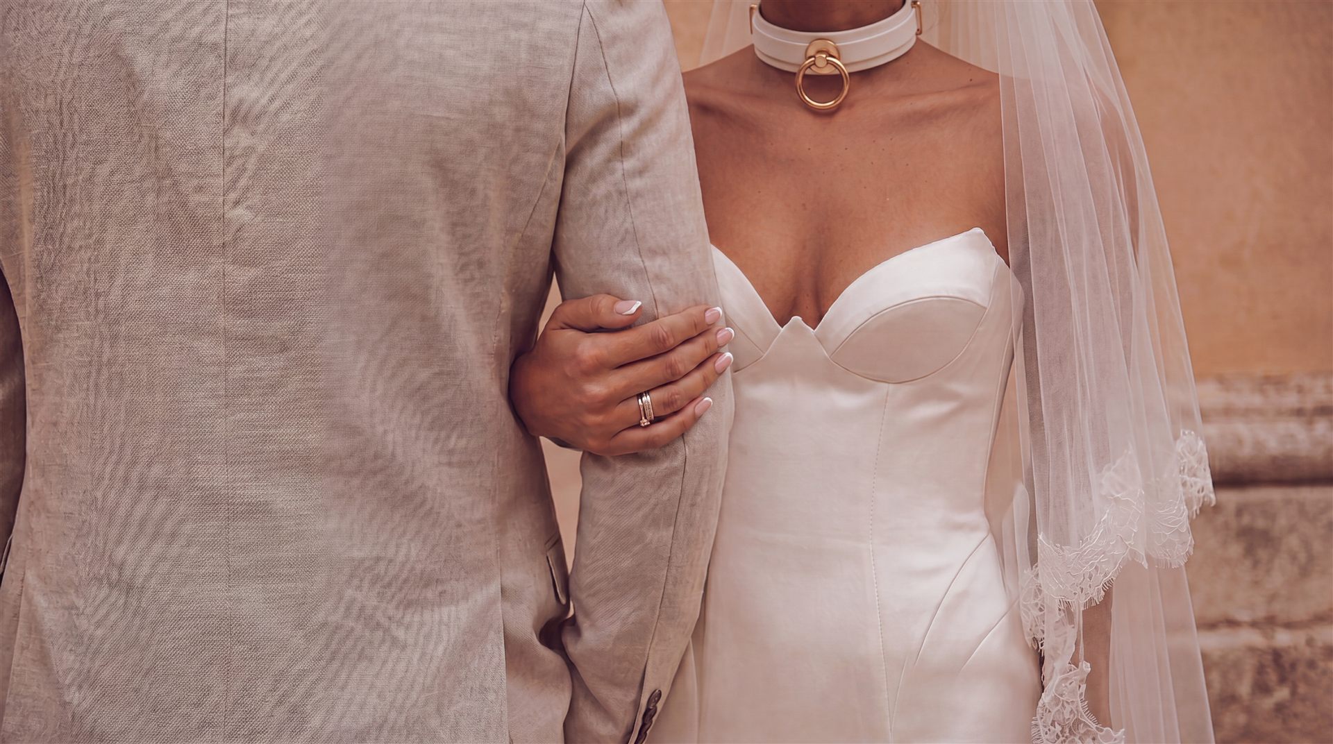 Bride and groom hands with rings — the vow