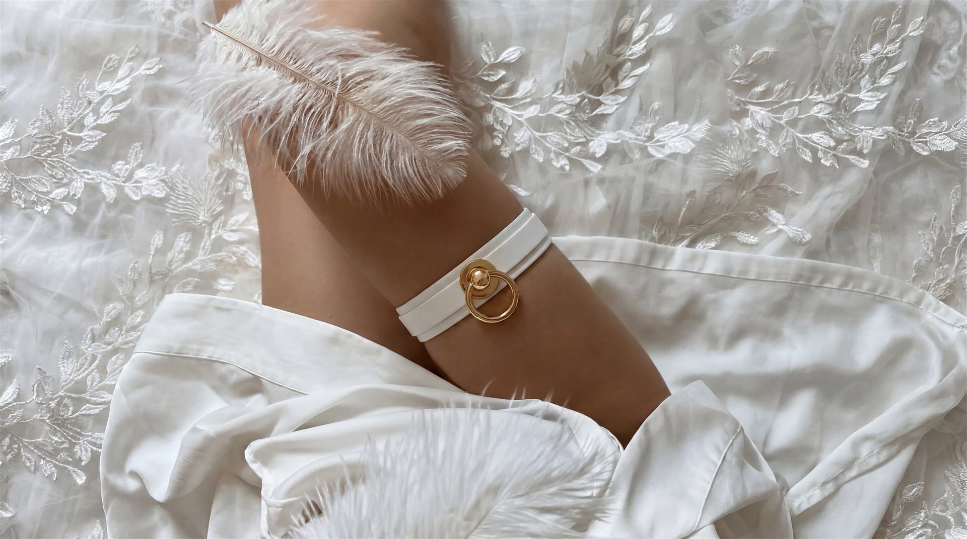 White leather wrist cuff on silk fabric